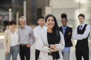 group of multiracial businessmen, arab woman in front, team